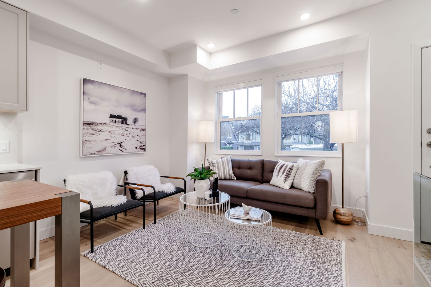 Living room with white oak floors and casement windows